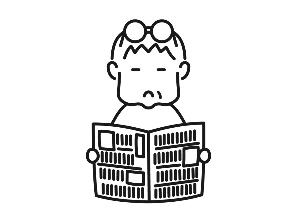 新聞を読む高齢者